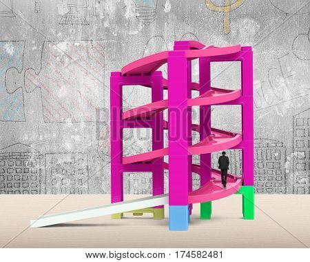 Man Walking On Unfinished Spiral Track In Stacking Blocks