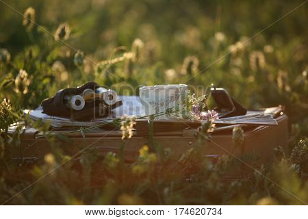 a cup of tea on the sunset light and pearl operaglasses