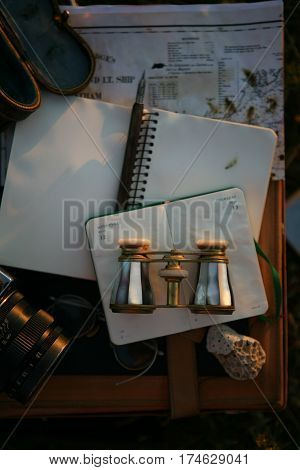vintage pearl operaglasses and notepads in the sunset light