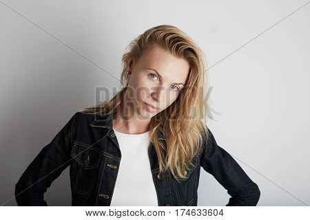 Portrait of beautiful woman smiling. Posing infront of empty background.