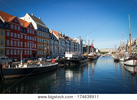 copenhagen colored buildings on its river on a blue sky background