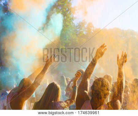 Holi hindu color festival. People holding hands up together