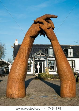 GRETNA GREEN, SCOTLAND - 21 JAN. 2017: Sculpture by Ray Lonsdale of clasping hands at Gretna Green, the town on the Scottish border where eloped couples get married