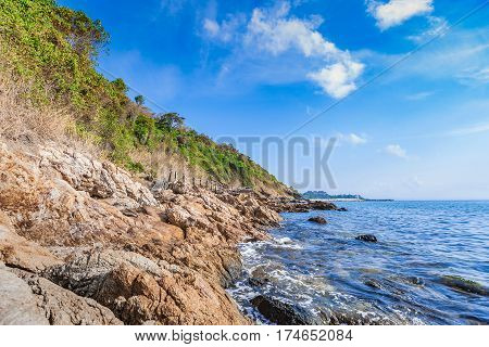 Beautiful seascape with rocks and meadow in cloudy blue sky at Khao Leam Ya National Park Rayong province Thailand