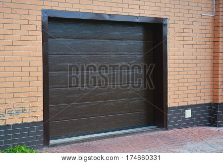 House garage door with plastic garage ventilation outdoor.