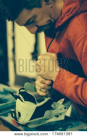 Snowboard Repair Shop Worker Adjust The Bindings