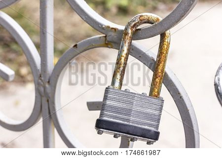 The lock on the metal fence closeup
