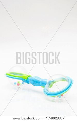 rattle on white background with copy space