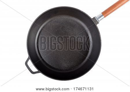 empty cast-iron frying pan isolated on white background