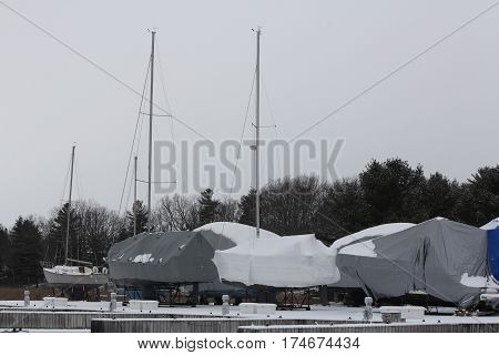 Shrink wrap on boats, on dry land during the winter season as protection against elements.