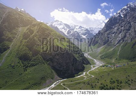 green valley of the Caucasus Mountains in summer. sunrise