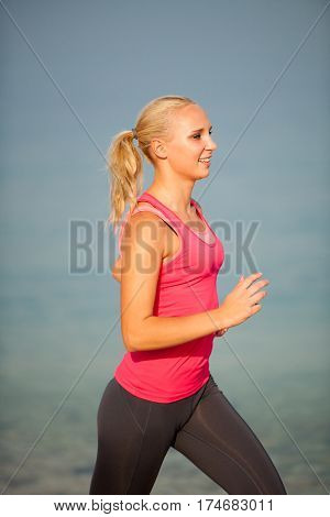 Jogging In Th Beach - Woman Runns Near Sea On Early Summer Morning