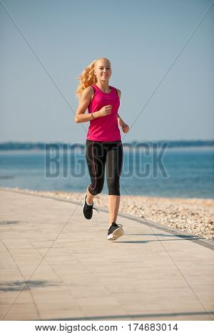Jogging In Th Beach - Woman Runns Near Sea On Early Summer Morning