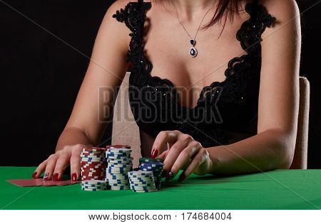 pretty young woman gambling on green table