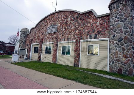 MANCELONA, MICHIGAN / UNITED STATES - NOVEMBER 27, 2016: The Mancelona Village Offices are in an old stone building in downtown Mancelona, together with the Township Ambulance Authority and Allied Emergency Management Services (EMS).