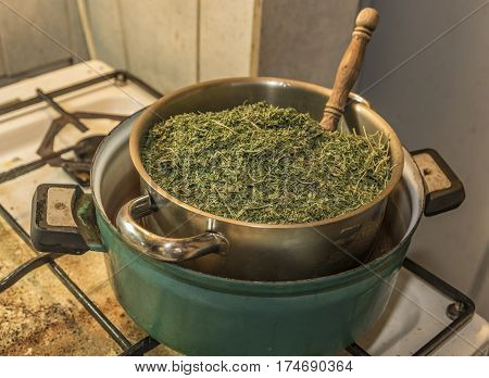Medical Marijuana Leafs Butter Cooking With Water