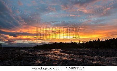 Beautiful sunset on the river Studenaya. Kamchatka Peninsula.