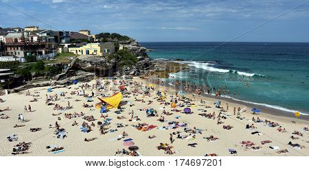 Sydney Australia - Feb 5 2017. People relaxing swimming and sun bathing on Tamarama beach.