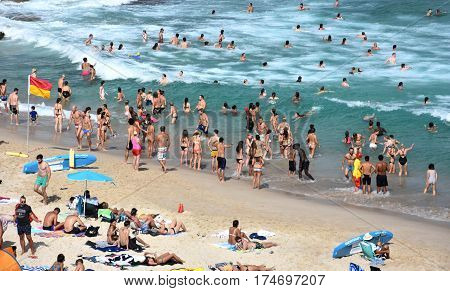 Sydney Australia - Feb 5 2017. People relaxing swimming and sun bathing on Tamarama beach.