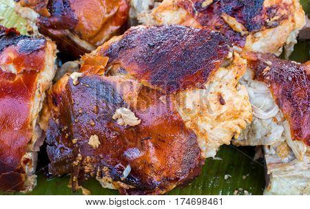 Juicy pork meat cooked on grill. Traditional cuisine of Spain. Sliced pork barbecue with gold skin. Spanish dish lechon close image for restaurant menu or eatery illustration. Tasty meat ready for eat