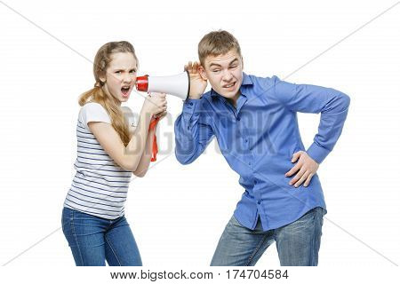 Teen age girl screaming at boy through megaphone. Brother and sister isolated on white background. Copy space.