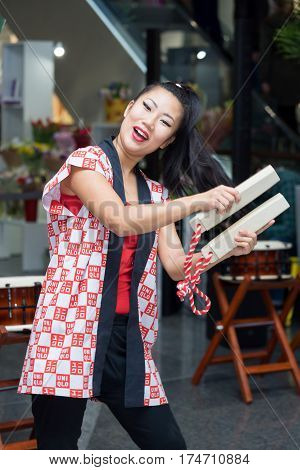 Moscow, Russia - March 5, 2017: Group Of Japanese Taiko Drummers Girls Perform In 