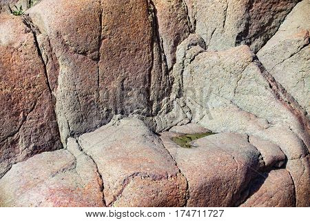 Close up of cracked rock fragment with texture