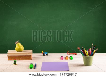 Back to school concepty with clear blackboard background, desk, items