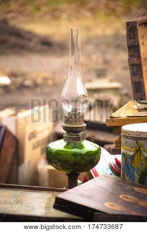 Old paraffin lamp at a flea market close up.