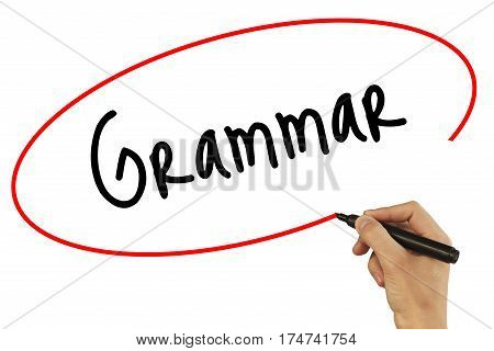 Man Hand Writing Grammar With Black Marker On Visual Screen. Isolated On Background. Business, Techn