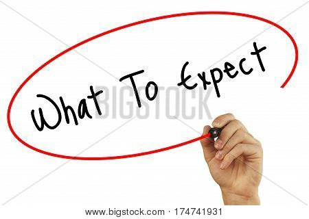 Man Hand Writing What To Expect With Black Marker On Visual Screen. Isolated On Background. Business