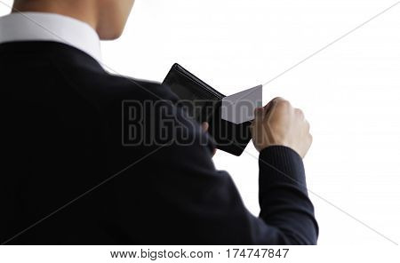 Business man taking credit card out of purse