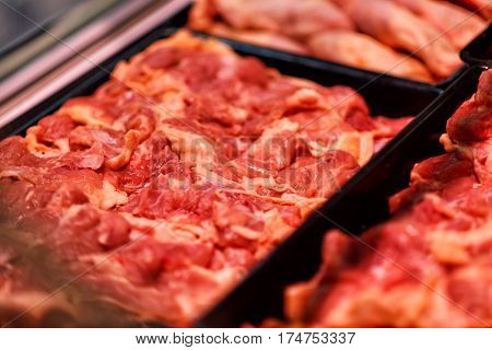 Heap of fresh raw meat food flesh background at shop supermarket.