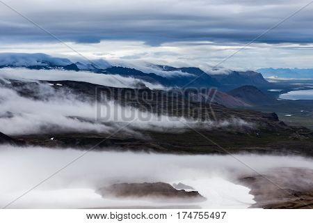 Clouds Flowing Low In The Beautiful Iceland Mountain Landscape - View From The Slope Of Snaefellsjok