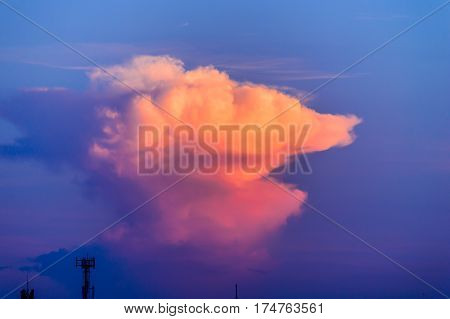 Beautiful cloudy sunset sky with light rays. Cloudy abstract background.