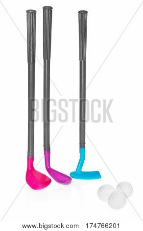 Mini golf set toy for children plastic golf stick and balls. Golf staves in the colors purple blue. Set to play isolated on white background with light shadow and reflection.