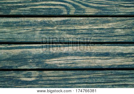 Green wood planks photo background. Rough timber table texture. Warm brown wooden backdrop for shabby chic design. Timber texture closeup. Rustic wooden table wallpaper or banner template