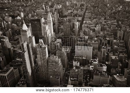 New York City rooftop view with downtown Manhattan skyscrapers and urban cityscape.