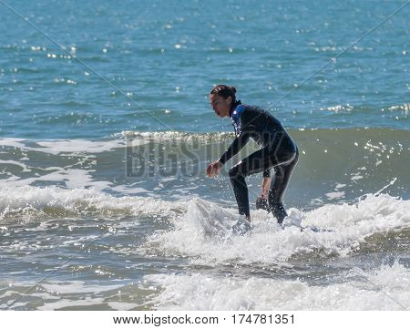 Young Man Exercising In Surfing On The Board