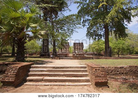 Royal Palace Polonnaruwa or Pulattipura ancient city of the Kingdom of Polonnaruwa in Sri Lanka with green trees and palms
