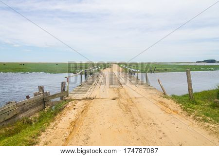 Dirty Road And Bridge At Lagoa Do Peixe Lake