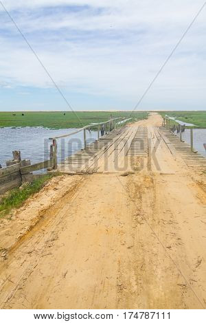 Dirty Road And Bridge At Lagoa Do Peixe Lake