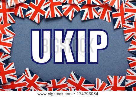 The word UKIP which stands for United Kingdom Independence Party with a border of union jack flags