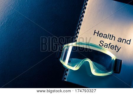 Health And Safety Document With Goggles