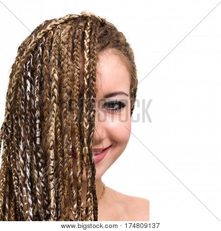 Portrait of young smiling woman with dreadlocks isolated on white background