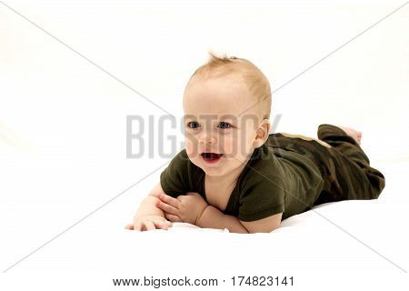Adorable laughing nine-month-old baby boy. Horizontal studio shot. Copy space