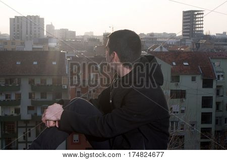 Beautiful sunsets and views of the city while I photographing Danila Mazić in black coat and black pants, Novi Sad, Serbia