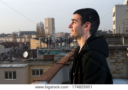Beautiful sunsets and views of the city while I photographing Danila Mazić in black coat and black pants, Novi Sad, Serbia