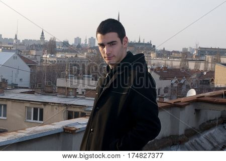 Beautiful sunsets and views of the city while I photographing Danila Mazić in black coat and black pants, Novi Sad, Serbia