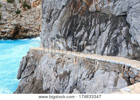 Cliff With Path At Platja De Torrent De Pareis, Majorca, Spain